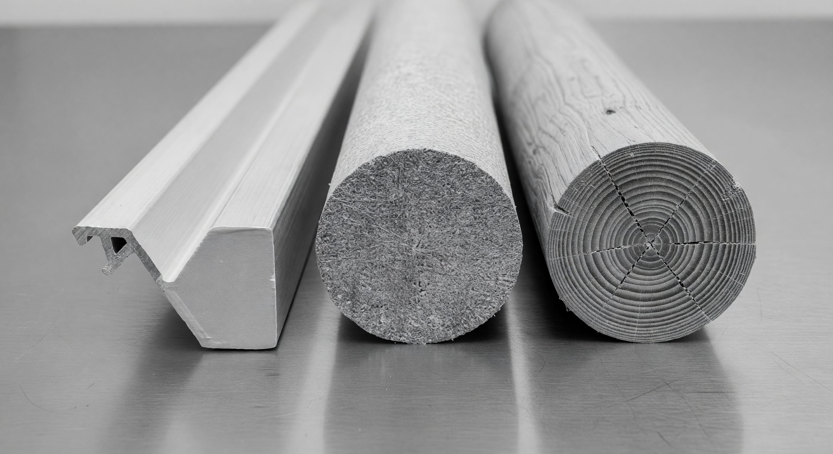 Side-by-side comparison of aluminum, fiberglass, and wooden barrier gate arms