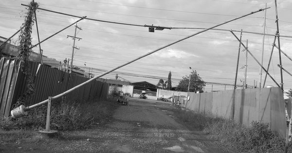 Community checkpoint boom barrier gate on a local road