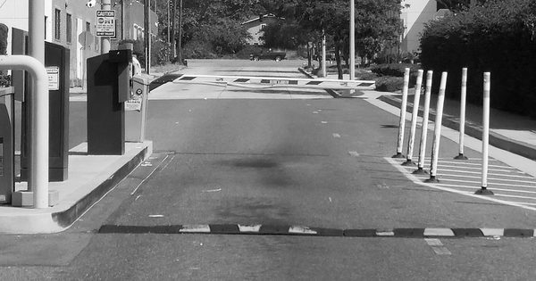 Boom barrier gate in closed position at a parking lot exit