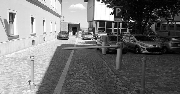 Hotel parking area with automatic boom barrier gate