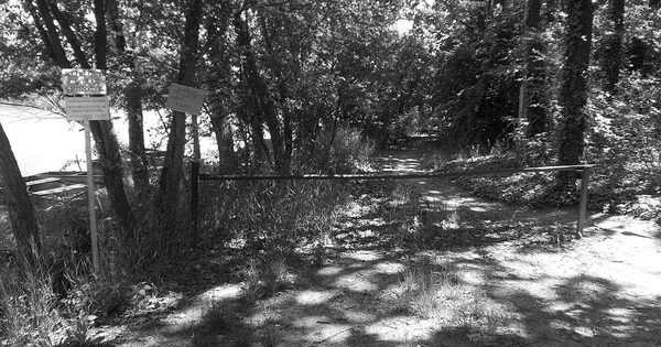 Automatic boom barrier gate at a boat harbor access road