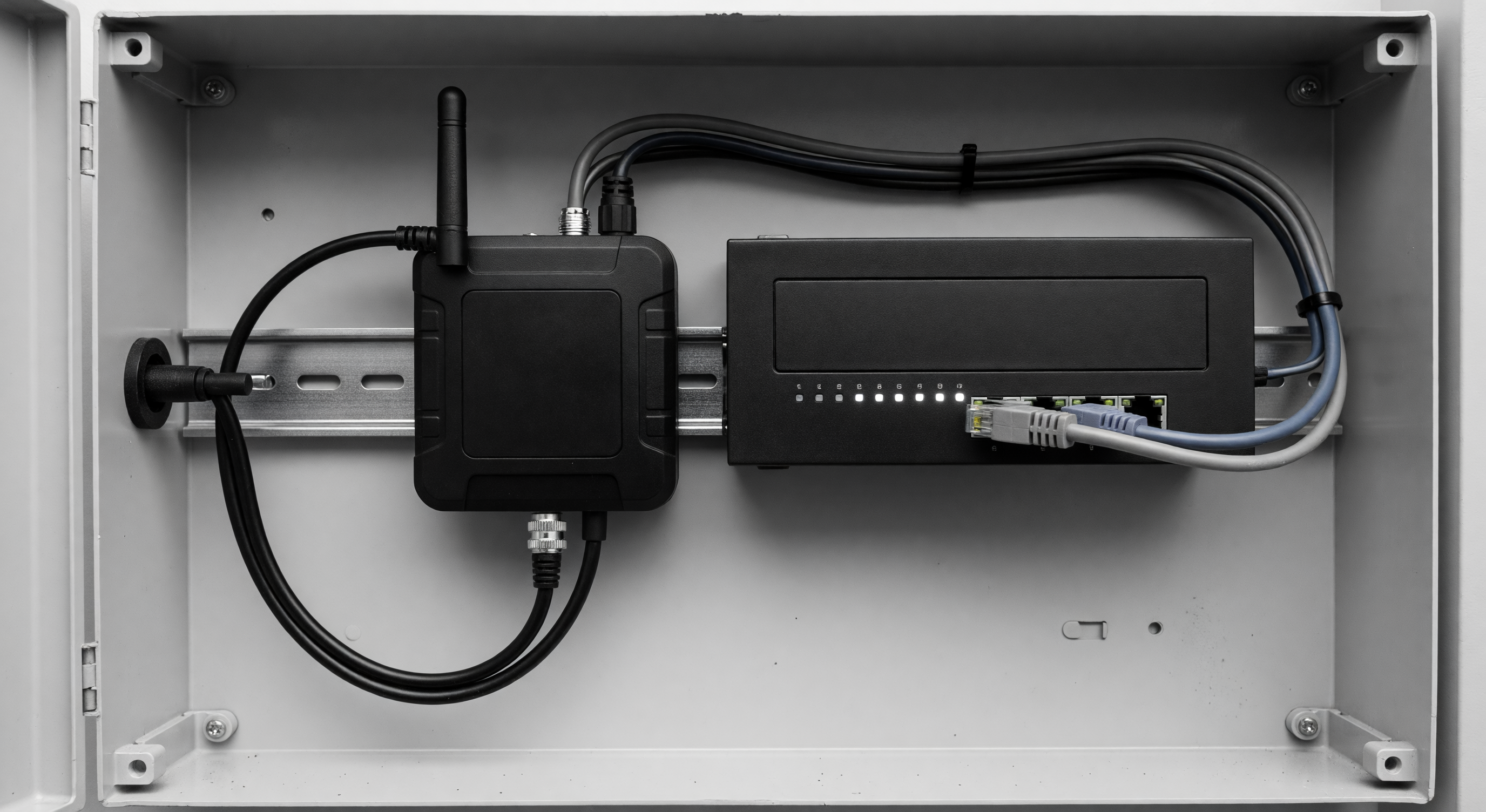 Barrier gate controller cabinet showing both a cellular modem and an ethernet network switch installed