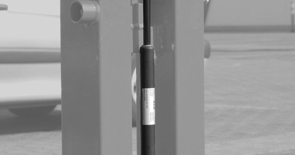 Detail of a barrier gate operator mechanism and gas spring