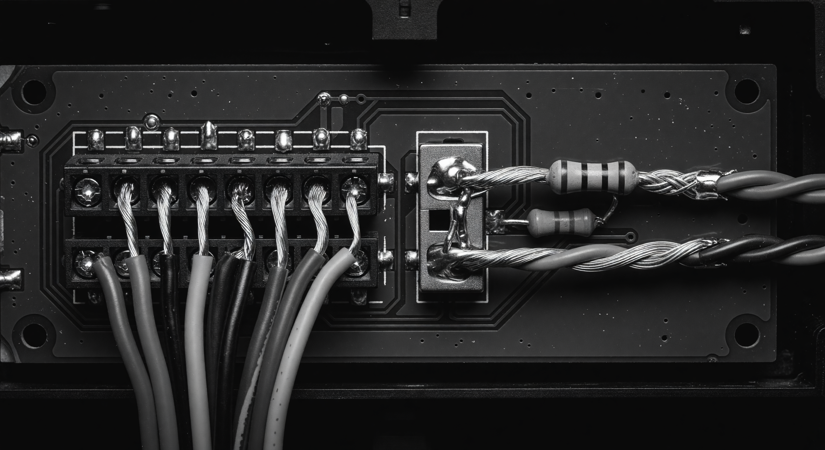 A wiring terminal strip showing reader cable terminations inside a gate controller cabinet